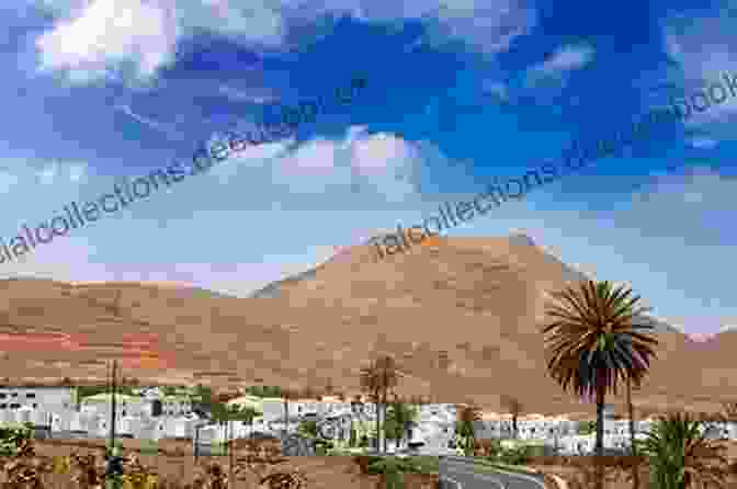 A Panoramic View Of The Whitewashed Village Of Yaiza In Lanzarote, Nestled Amidst The Volcanic Landscape Insight Guides Pocket Lanzarote Fuertaventura (Travel Guide EBook)